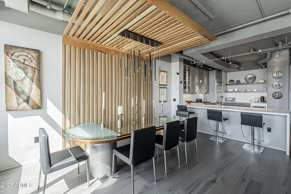 a kitchen with a table chairs stove and cabinets