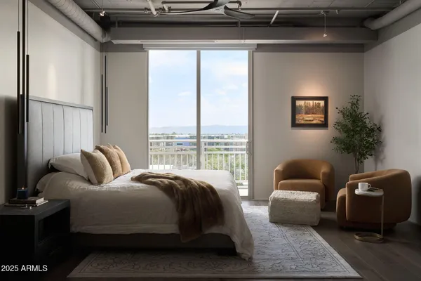 a bedroom with furniture and a window