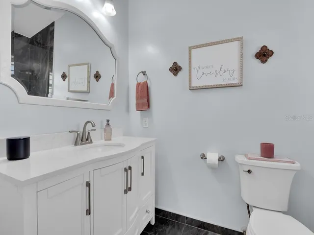 a bathroom with a sink and a toilet