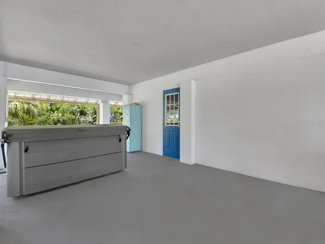 a view of room with window and furniture