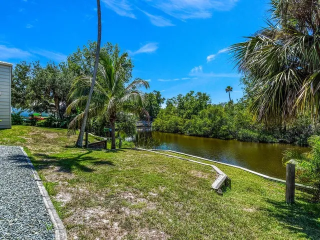 a view of a lake with a yard
