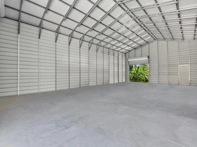 a view of an chairs and table in the garden