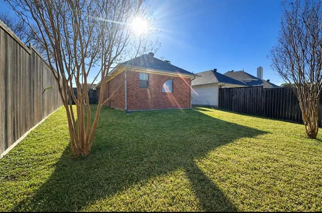 a view of a back yard of the house