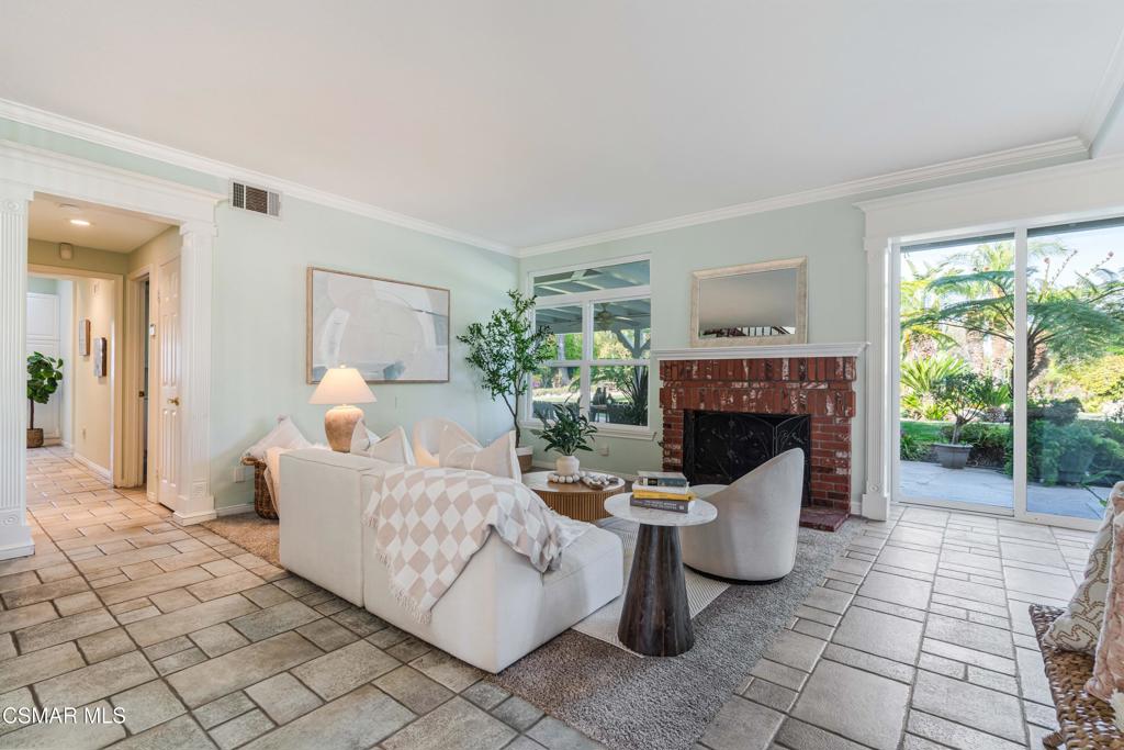 637 Bluegrass Street Simi Valley, CA 93065 - Photo 15 of 67 a living room with furniture a fireplace and a large window