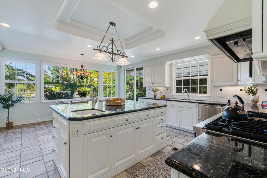 637 Bluegrass Street Simi Valley, CA 93065 - Photo 20 of 67 a kitchen with a sink stove and window