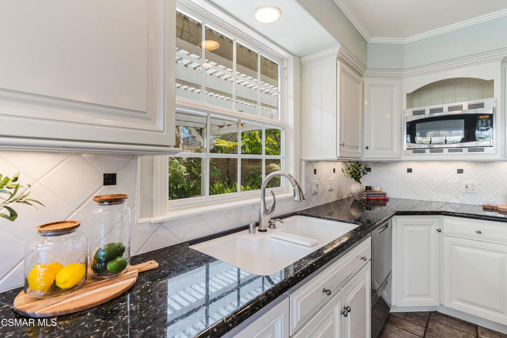 637 Bluegrass Street Simi Valley, CA 93065 - Photo 22 of 67 a kitchen with a sink and cabinets
