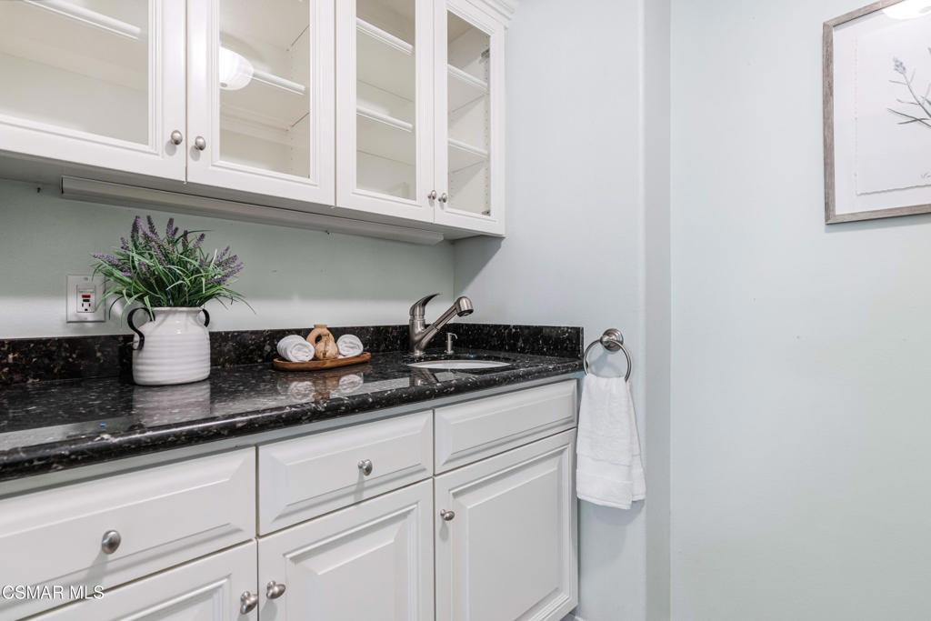 637 Bluegrass Street Simi Valley, CA 93065 - Photo 29 of 67 a kitchen with a sink and cabinets