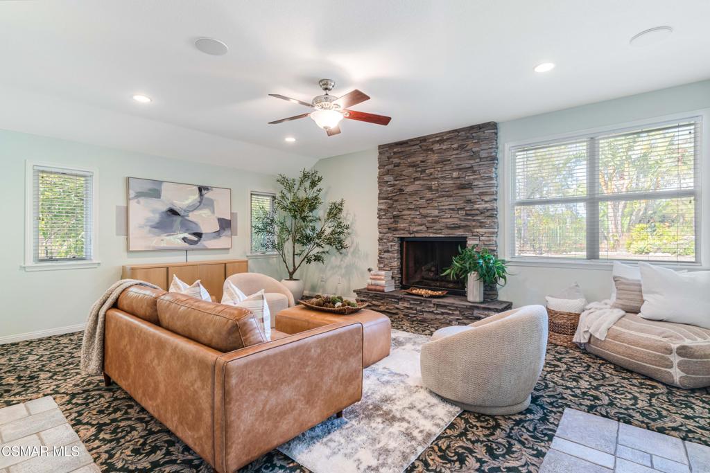 637 Bluegrass Street Simi Valley, CA 93065 - Photo 32 of 67 a living room with furniture and a fireplace