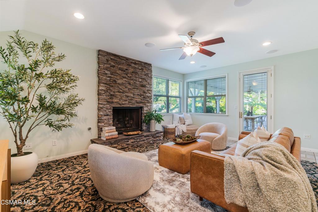 637 Bluegrass Street Simi Valley, CA 93065 - Photo 33 of 67 a living room with furniture and a fireplace
