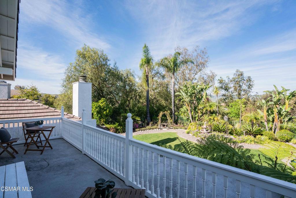 637 Bluegrass Street Simi Valley, CA 93065 - Photo 41 of 67 a balcony with wooden floor and outdoor seating