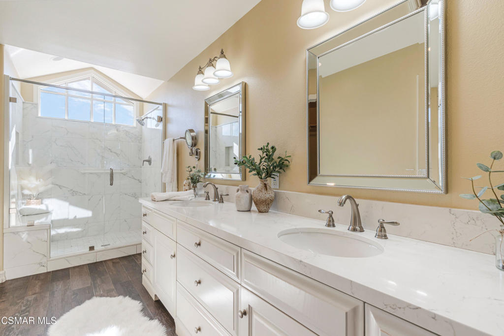 637 Bluegrass Street Simi Valley, CA 93065 - Photo 42 of 67 a bathroom with a sink double vanity and a mirror