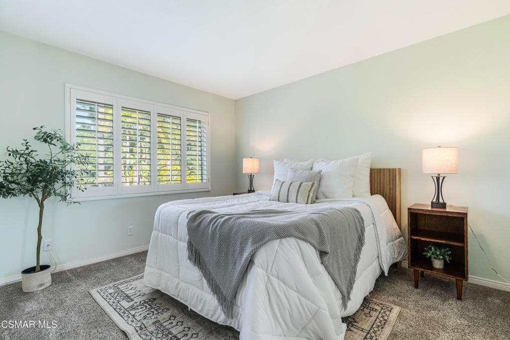 637 Bluegrass Street Simi Valley, CA 93065 - Photo 47 of 67 a bedroom with bed and a potted plant