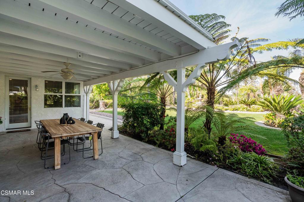 637 Bluegrass Street Simi Valley, CA 93065 - Photo 51 of 67 a view of a patio with table and chairs and potted plants