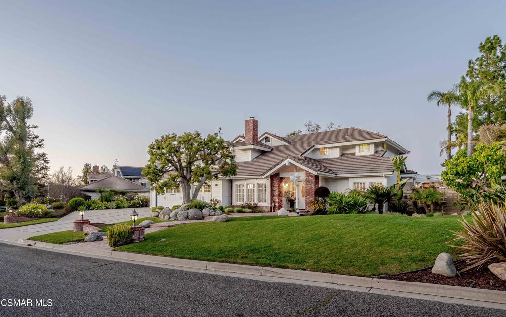 637 Bluegrass Street Simi Valley, CA 93065 - Photo 6 of 67 a front view of a house with a yard and outdoor seating