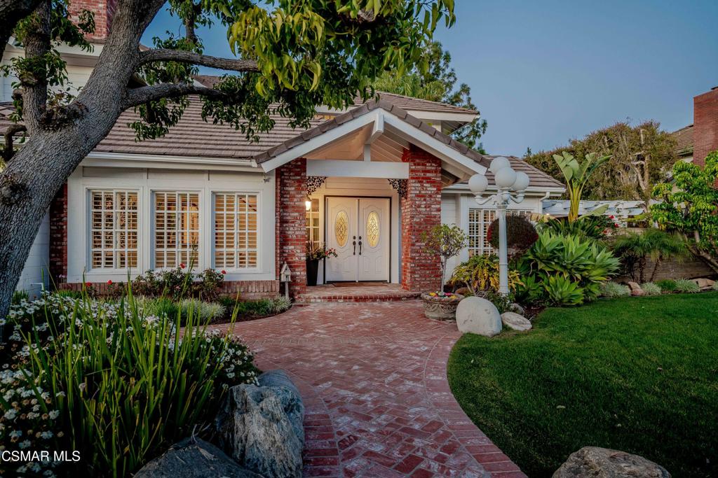 637 Bluegrass Street Simi Valley, CA 93065 - Photo 7 of 67 a view of a house with a small yard plants and large tree