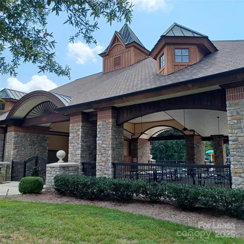 a group of people sitting in patio with a table and chairs