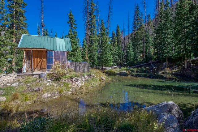 a view of a balcony with furniture