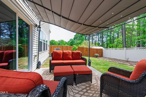a view of yard with a table and chairs