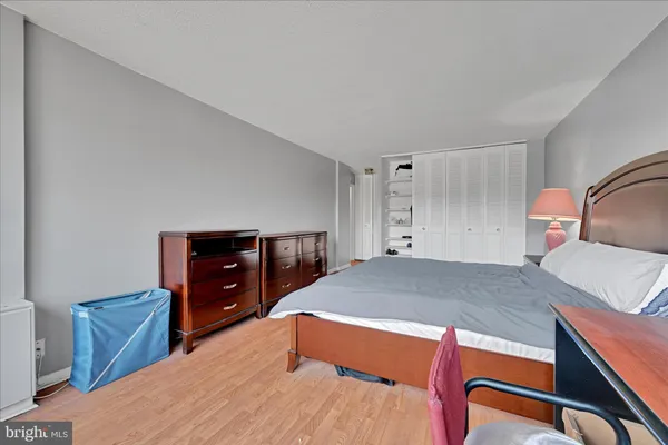 a bed room with a bed and a television