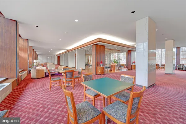 a outdoor living space with furniture and a rug