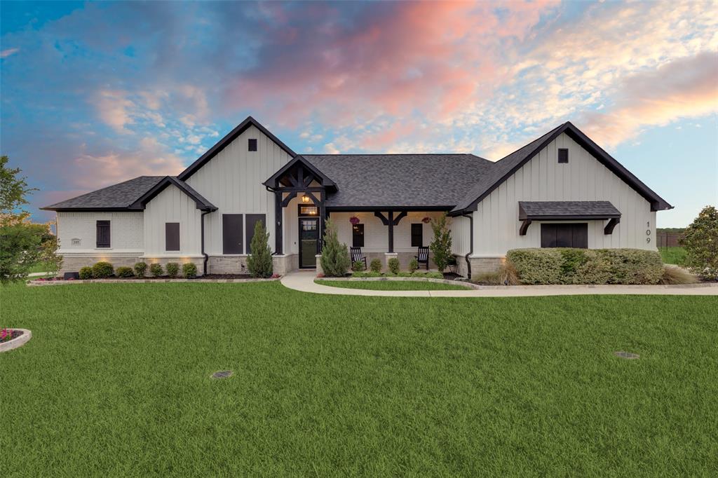 109 Highland Ranch Drive Paradise, TX 76073 - Photo 1 of 33 a front view of house with yard and green space