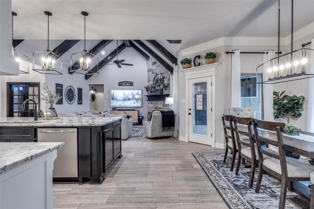 109 Highland Ranch Drive Paradise, TX 76073 - Photo 13 of 33 a kitchen with stainless steel appliances granite countertop a stove and refrigerator