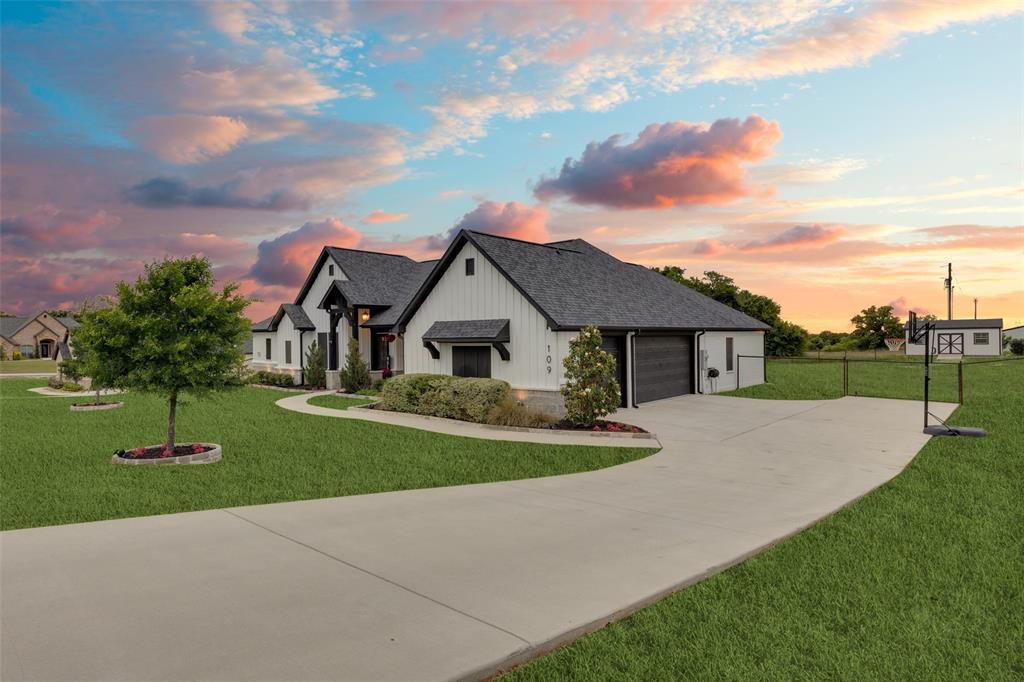 109 Highland Ranch Drive Paradise, TX 76073 - Photo 2 of 33 a front view of house with yard and green space