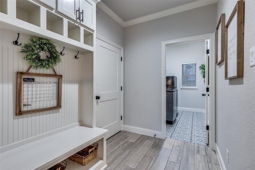 109 Highland Ranch Drive Paradise, TX 76073 - Photo 22 of 33 a view of a hallway with workspace and wooden floor