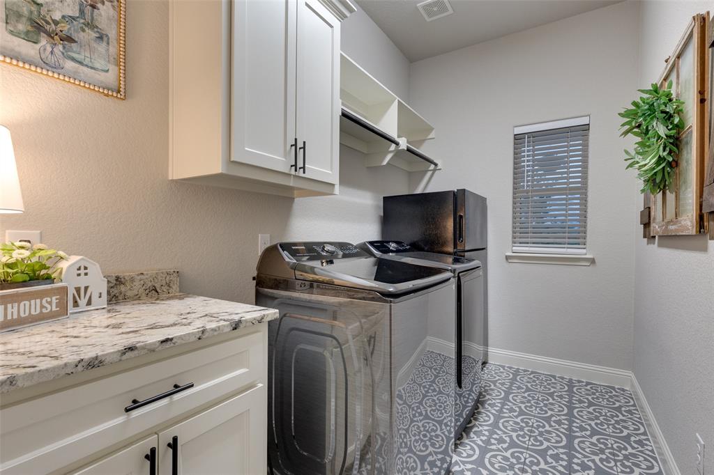 109 Highland Ranch Drive Paradise, TX 76073 - Photo 23 of 33 a kitchen with granite countertop a sink a stove and a window