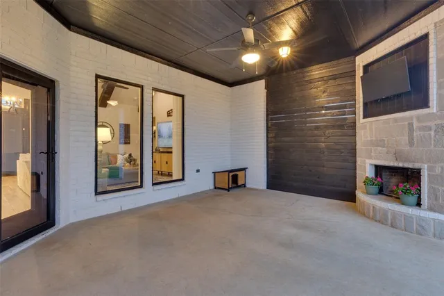 a view of a livingroom with an empty space and a fireplace