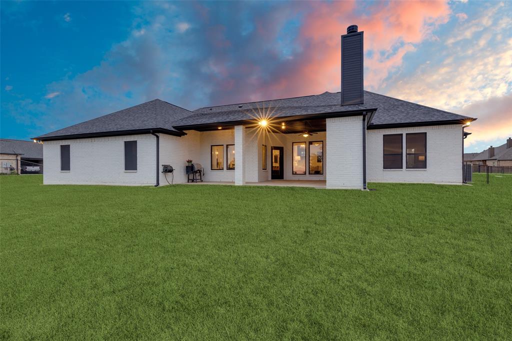 109 Highland Ranch Drive Paradise, TX 76073 - Photo 28 of 33 a front view of house with yard and green space