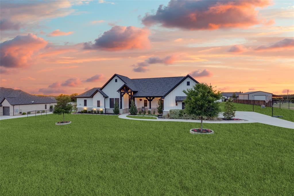 109 Highland Ranch Drive Paradise, TX 76073 - Photo 32 of 33 a front view of a house with a yard