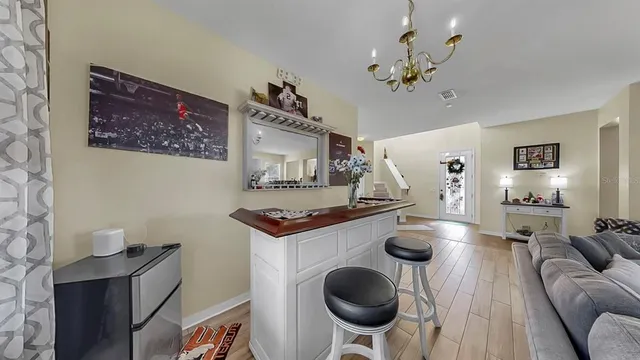 a kitchen with stainless steel appliances granite countertop a refrigerator and a stove