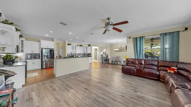 a spacious bathroom with a tub sink and mirror