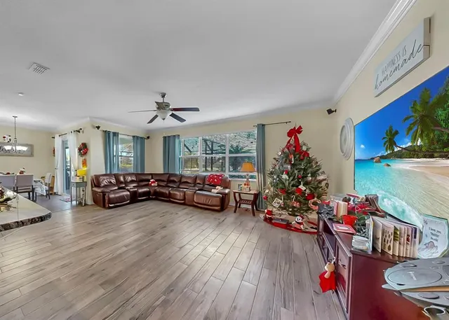 a bedroom with a bed a dresser and window
