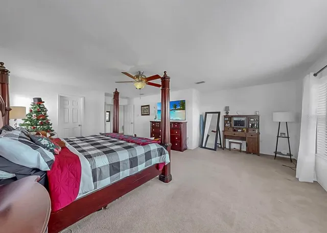 an aerial view of a house with swimming pool and garden