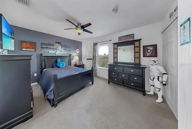 a front view of a house with a tree