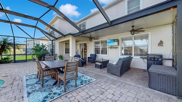 an aerial view of residential house with outdoor space and swimming pool