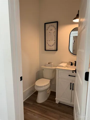 a kitchen with a center island appliances and cabinets