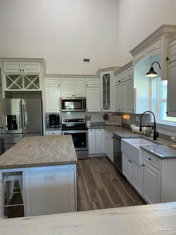 a kitchen with a table and chairs in it