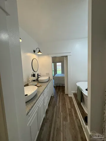 a bathroom with a bathtub and shower
