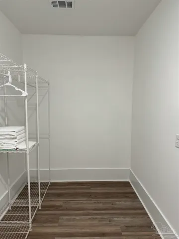 a bathroom with a toilet and shower