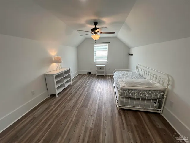 a view of an empty room and a window