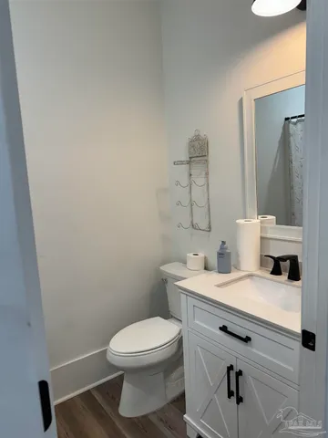 a kitchen with stainless steel appliances kitchen island granite countertop a stove a sink and a refrigerator