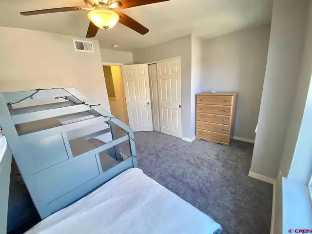 a view of an empty room and a bathroom