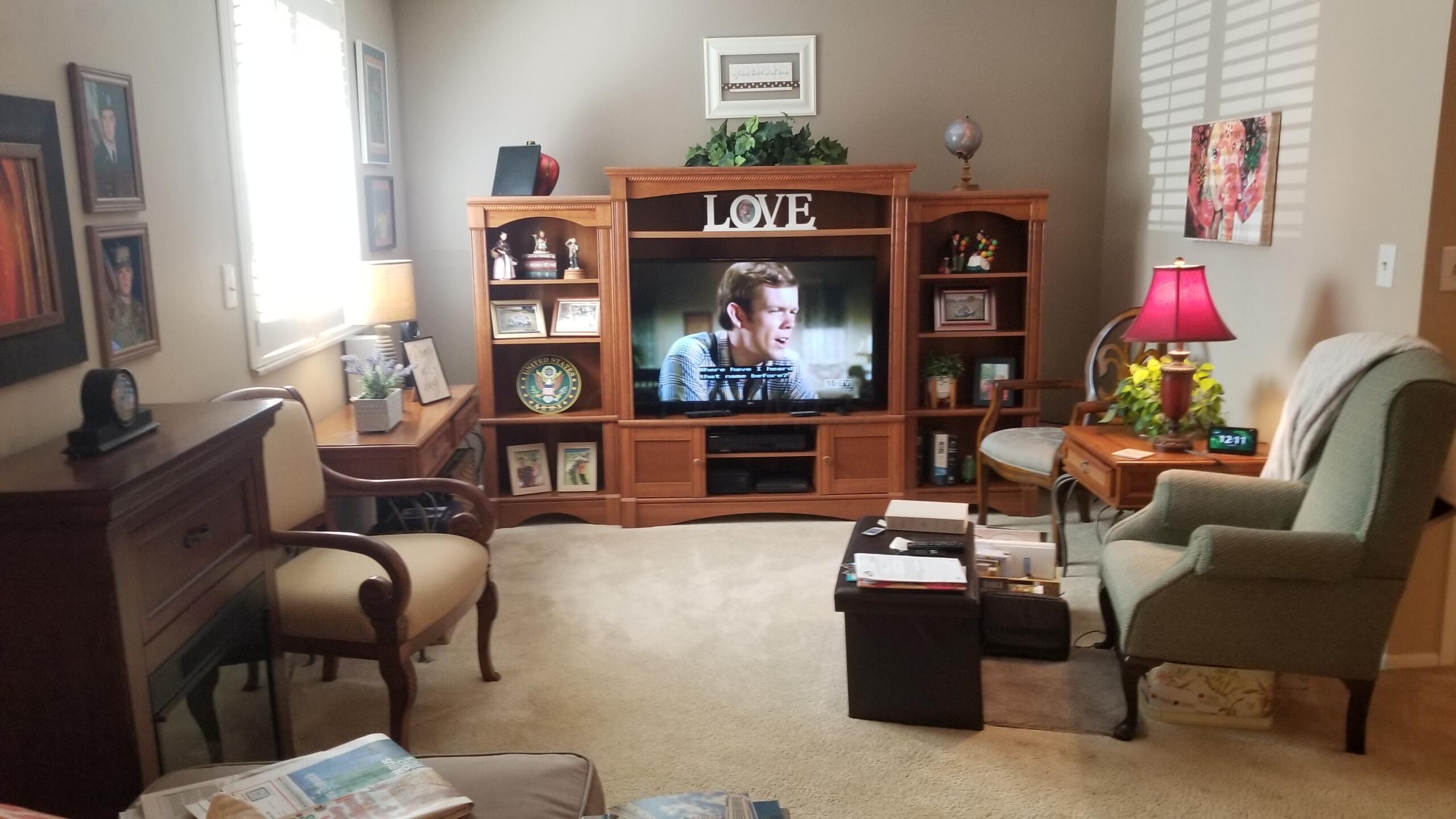 3939 Karl Road, Unit 111 Columbus, OH 43224 - Photo 6 of 22 Living room with large window, Across the room is a area for a dining room table or eating space at kitchen opening