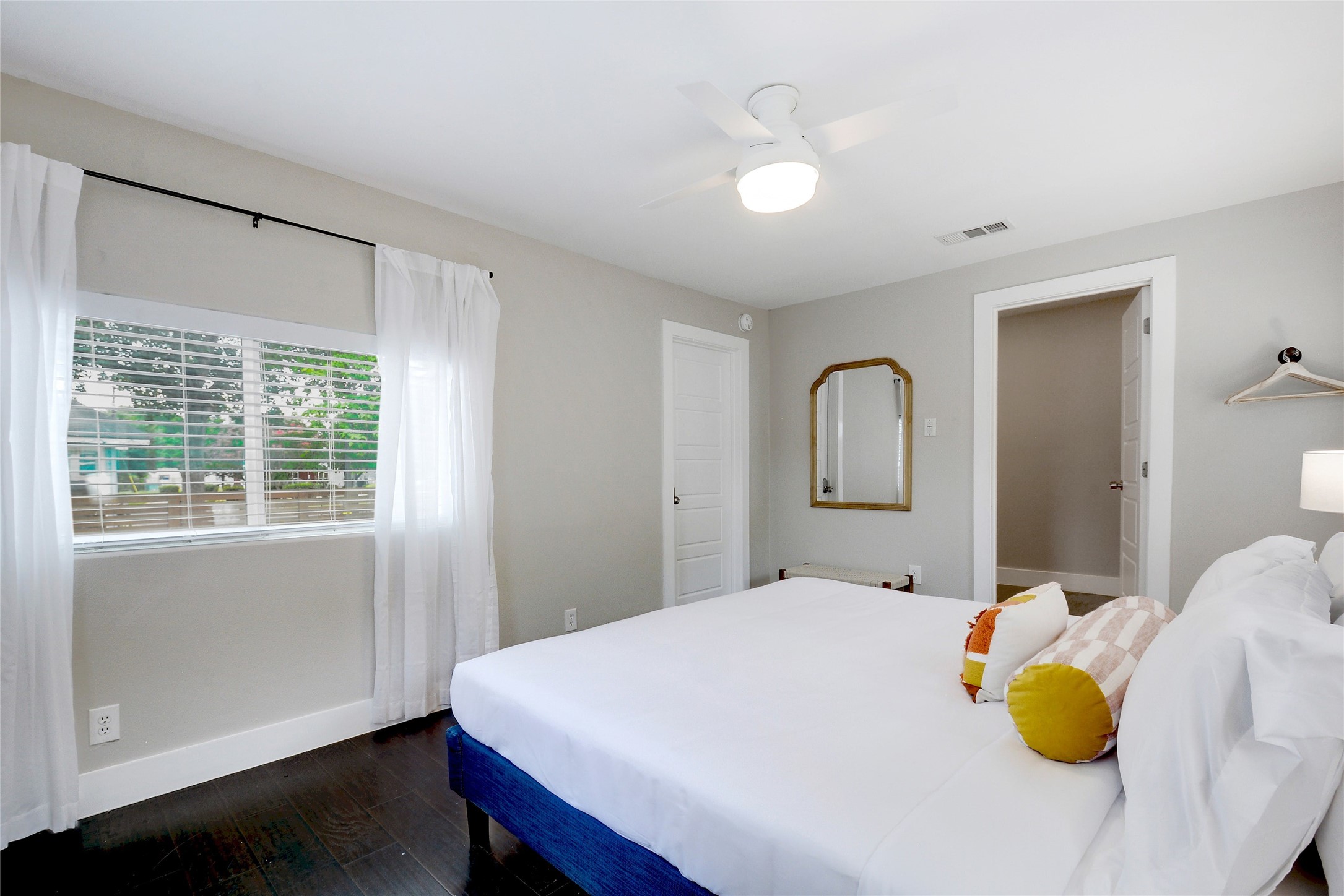 Undisclosed Address Austin, TX 78721 - Photo 14 of 35 Bedroom featuring dark wood-type flooring and ceiling fan