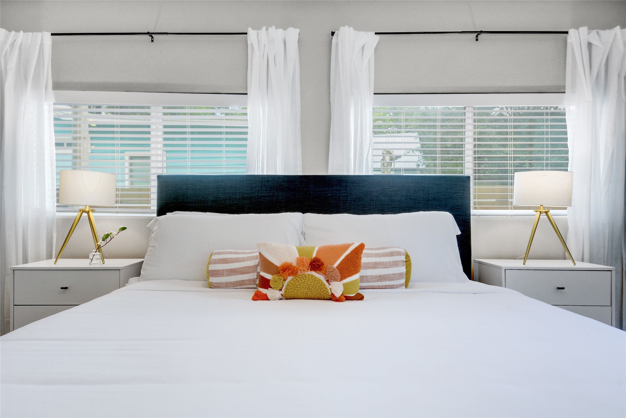 Undisclosed Address Austin, TX 78721 - Photo 15 of 35 Bedroom featuring multiple windows