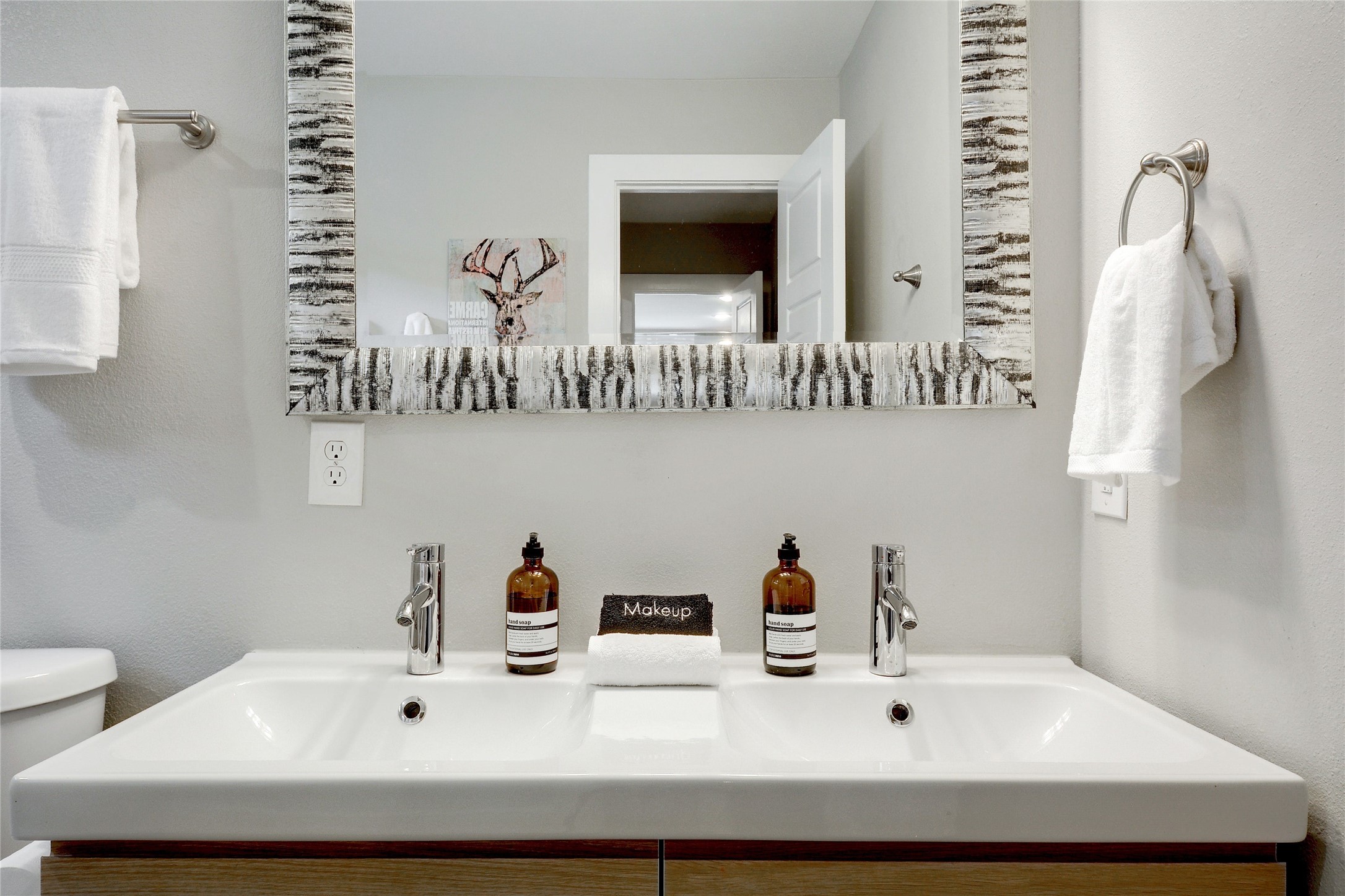 Undisclosed Address Austin, TX 78721 - Photo 23 of 35 Bathroom featuring double vanity and a textured wall