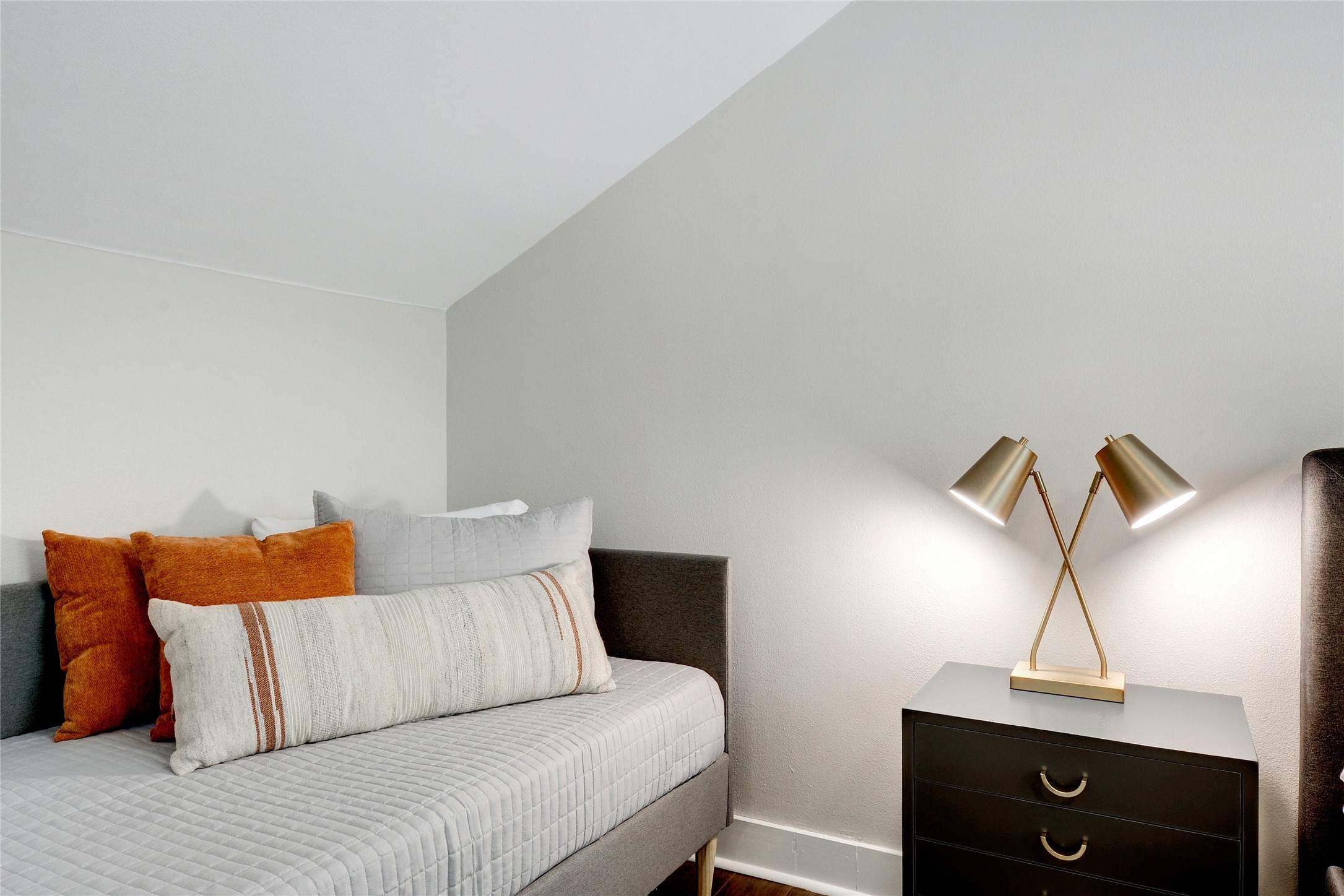 Undisclosed Address Austin, TX 78721 - Photo 28 of 36 a bedroom with a bed and a night stand